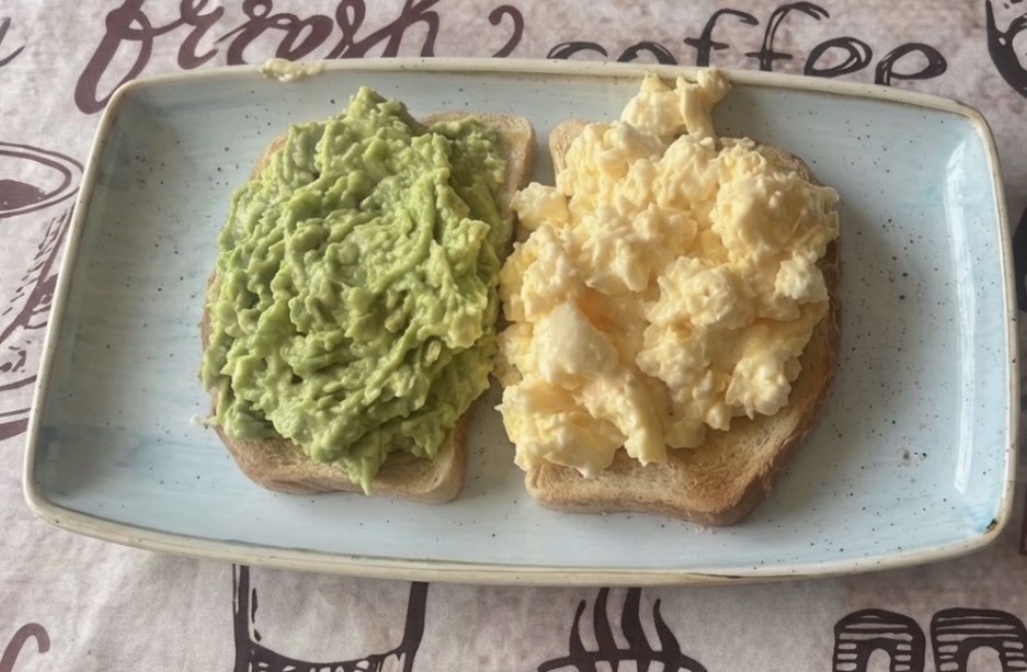 Crushed avocado and scrambled eggs on toast